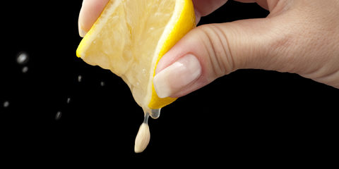 squeeze lemon juice on hand for the squeeze lemon juice on hand for the black background background